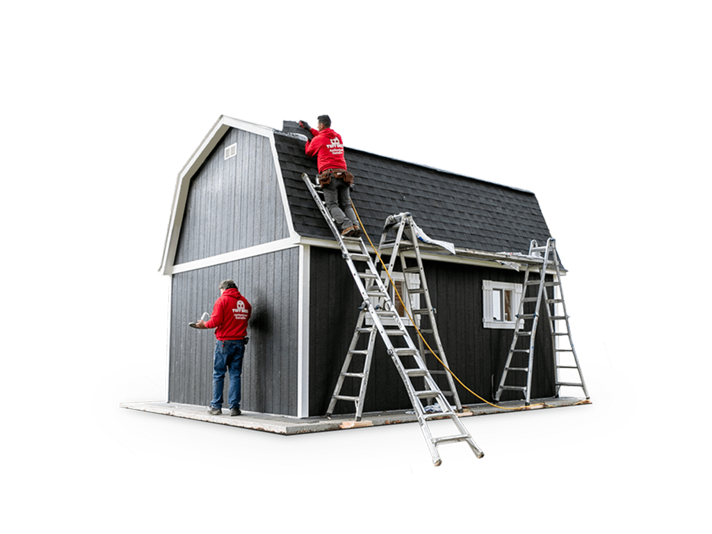 two people working on installation of the barn shed