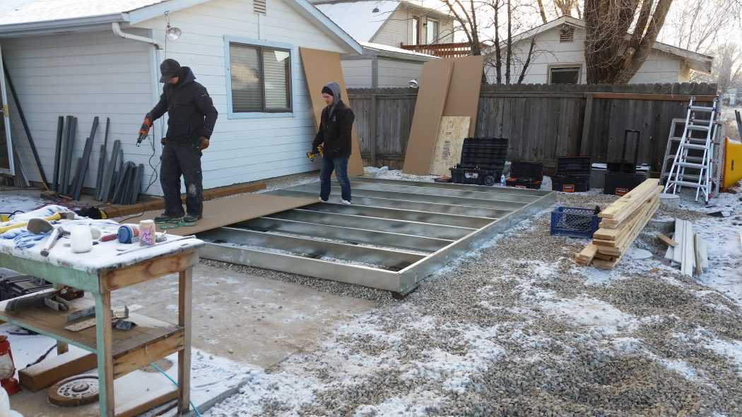 The process of the shed being built starting with the frame