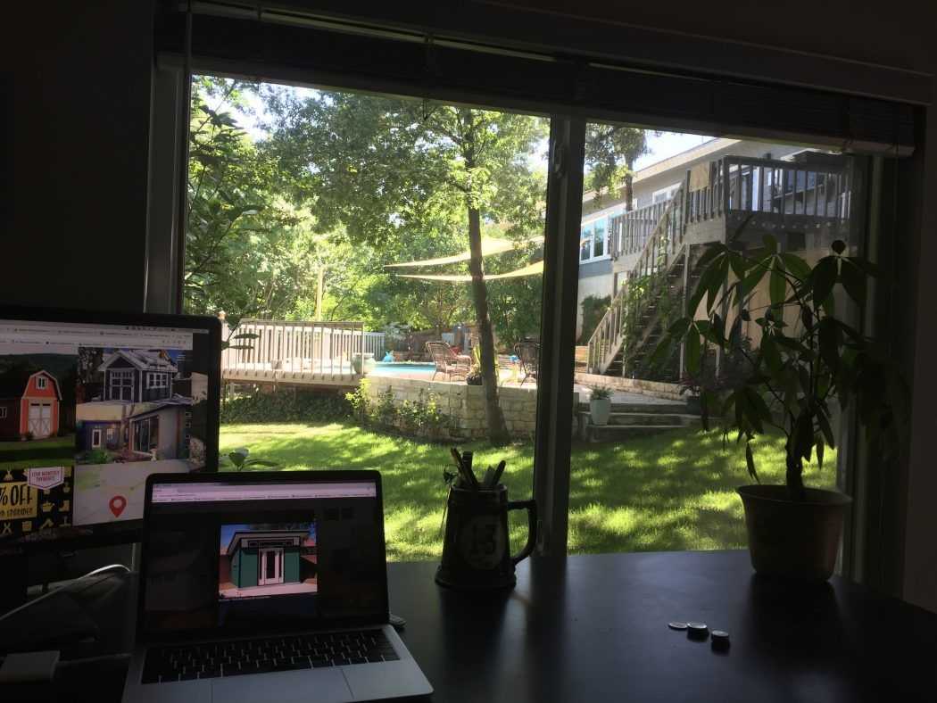 A photo of the inside of a shed with an office inside.