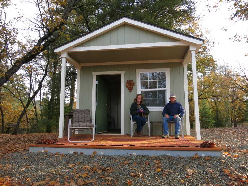 Kristi & Wayne on the front porch of the Premier Pro Ranch Weekender Retreat