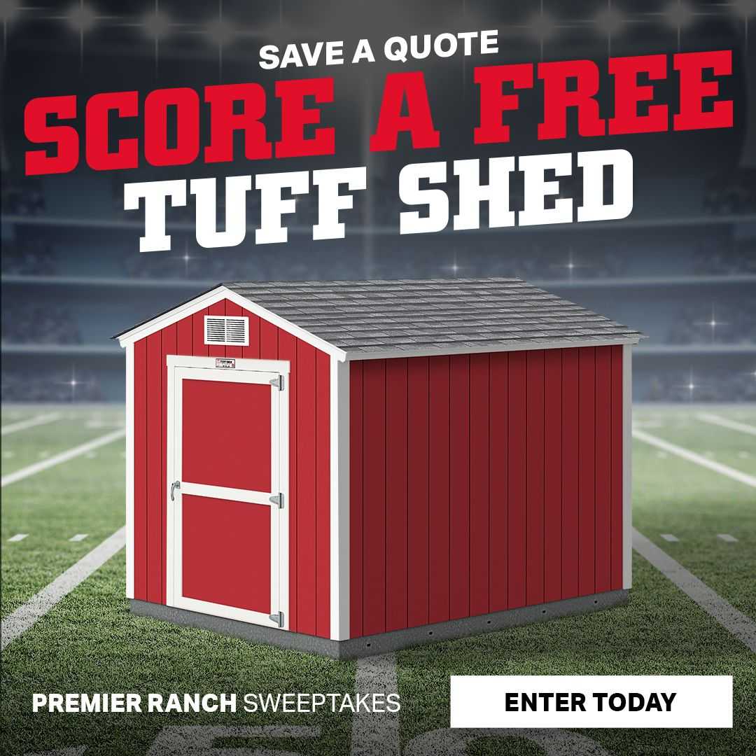 A red Tuff Shed building on a football field
