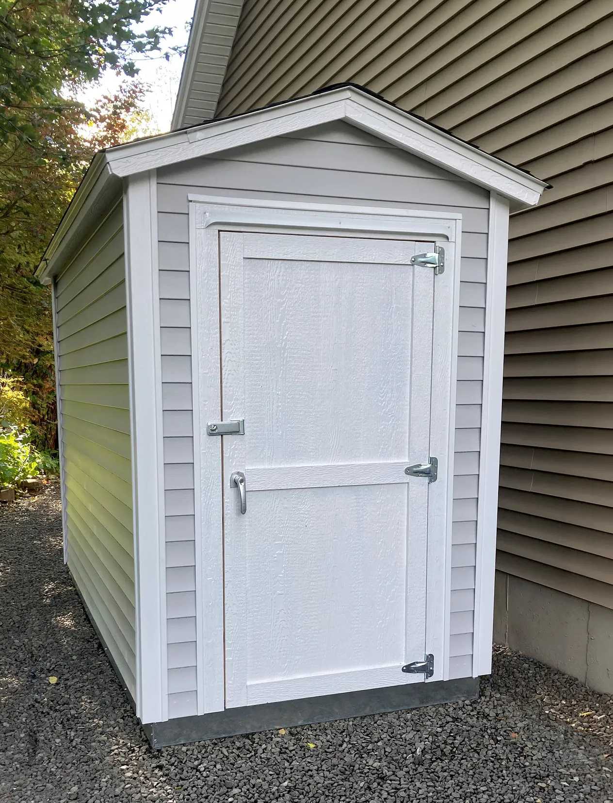 Smalls storage shed next to a house