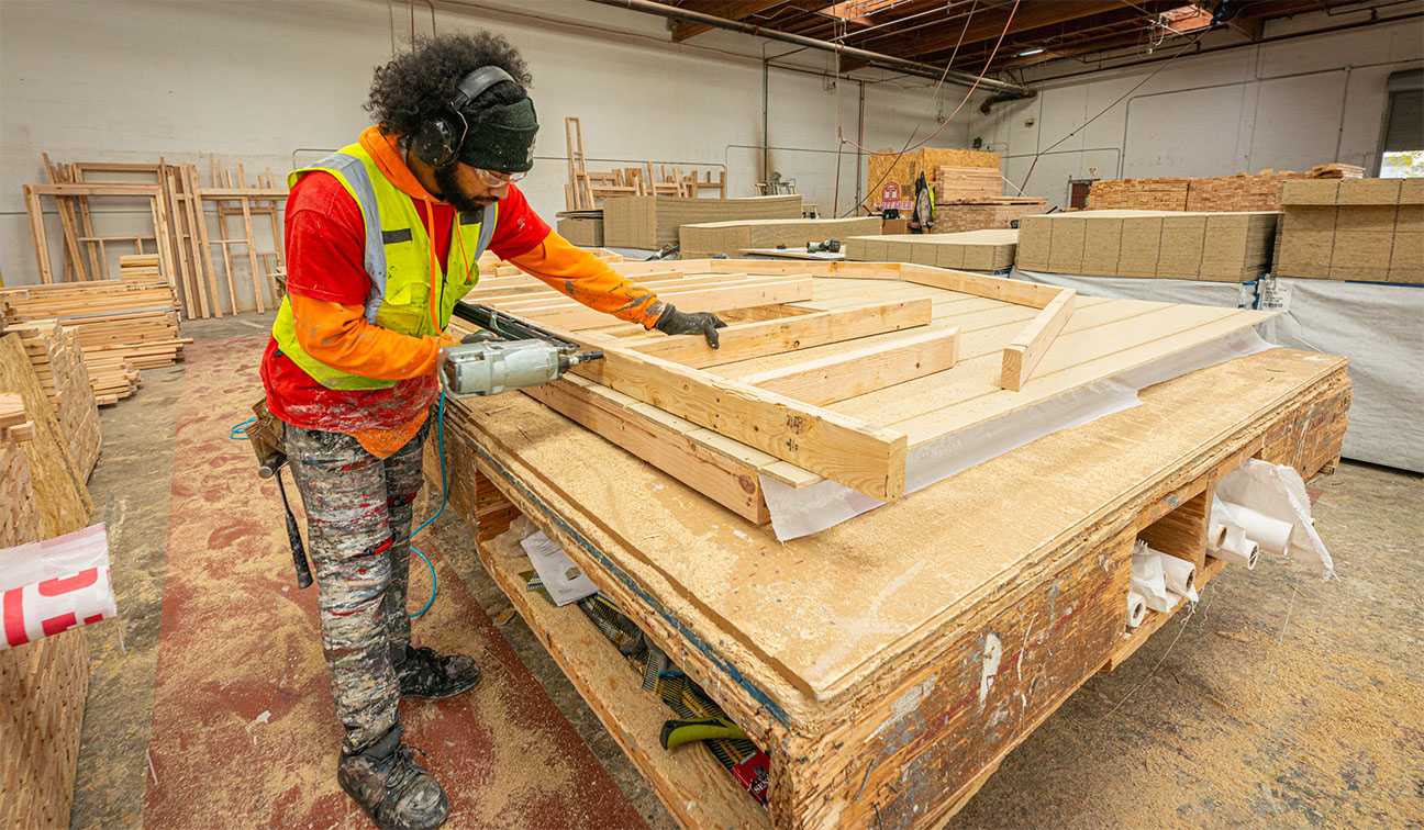 Tuff Shed employee pre-fabricating a wall