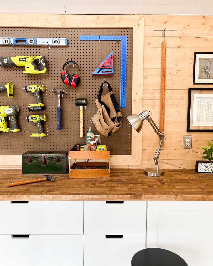 Interior of Premier Pro Tall Ranch workshop workbench and tools hung on the wall