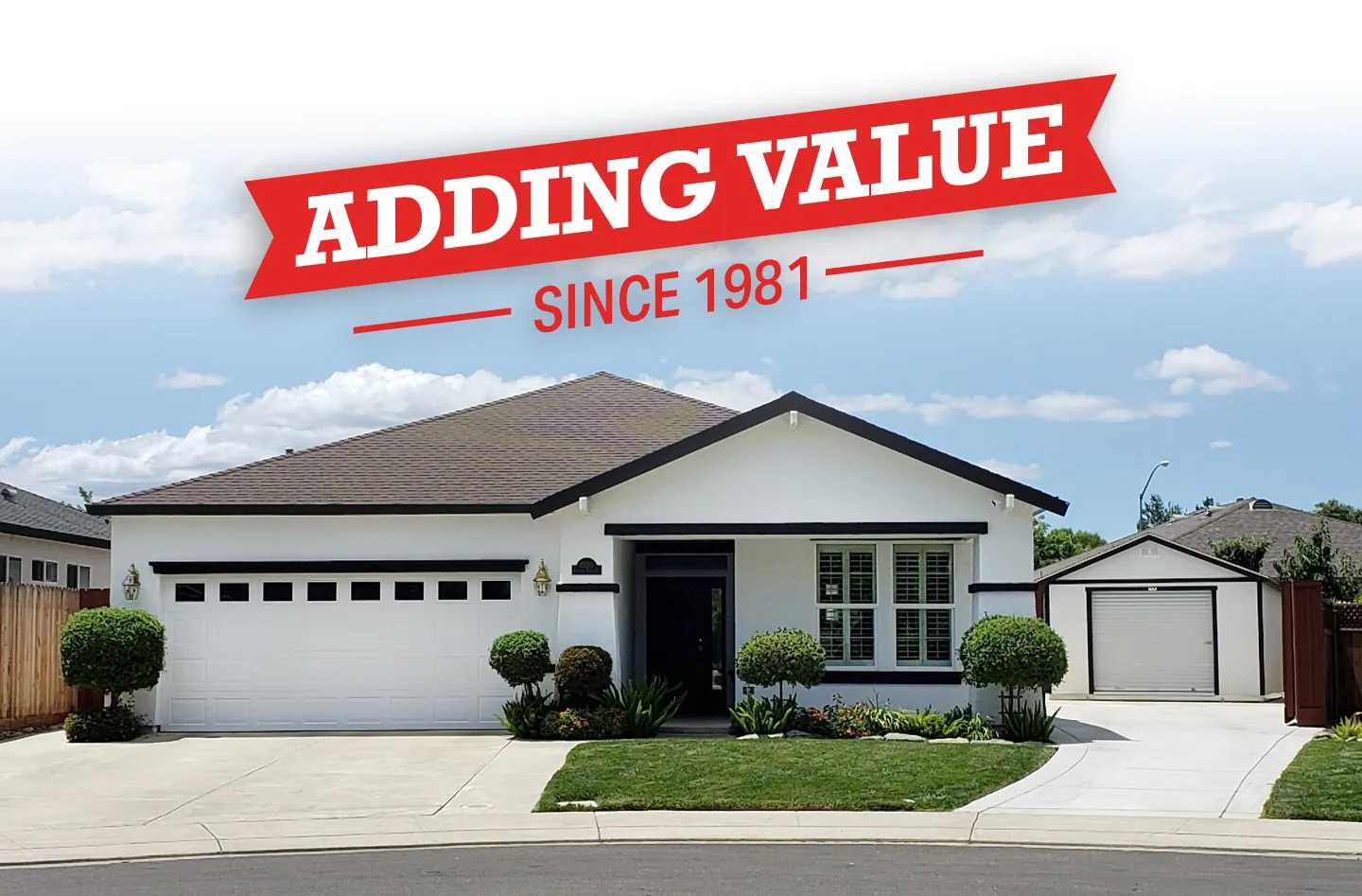 This photo is a white Premier Ranch Garage that added to a house. With text overlay reading adding value since 1981.