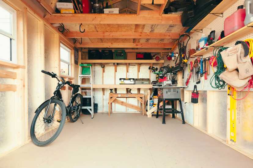 Interior of Premier Tall Barn with storage and bike