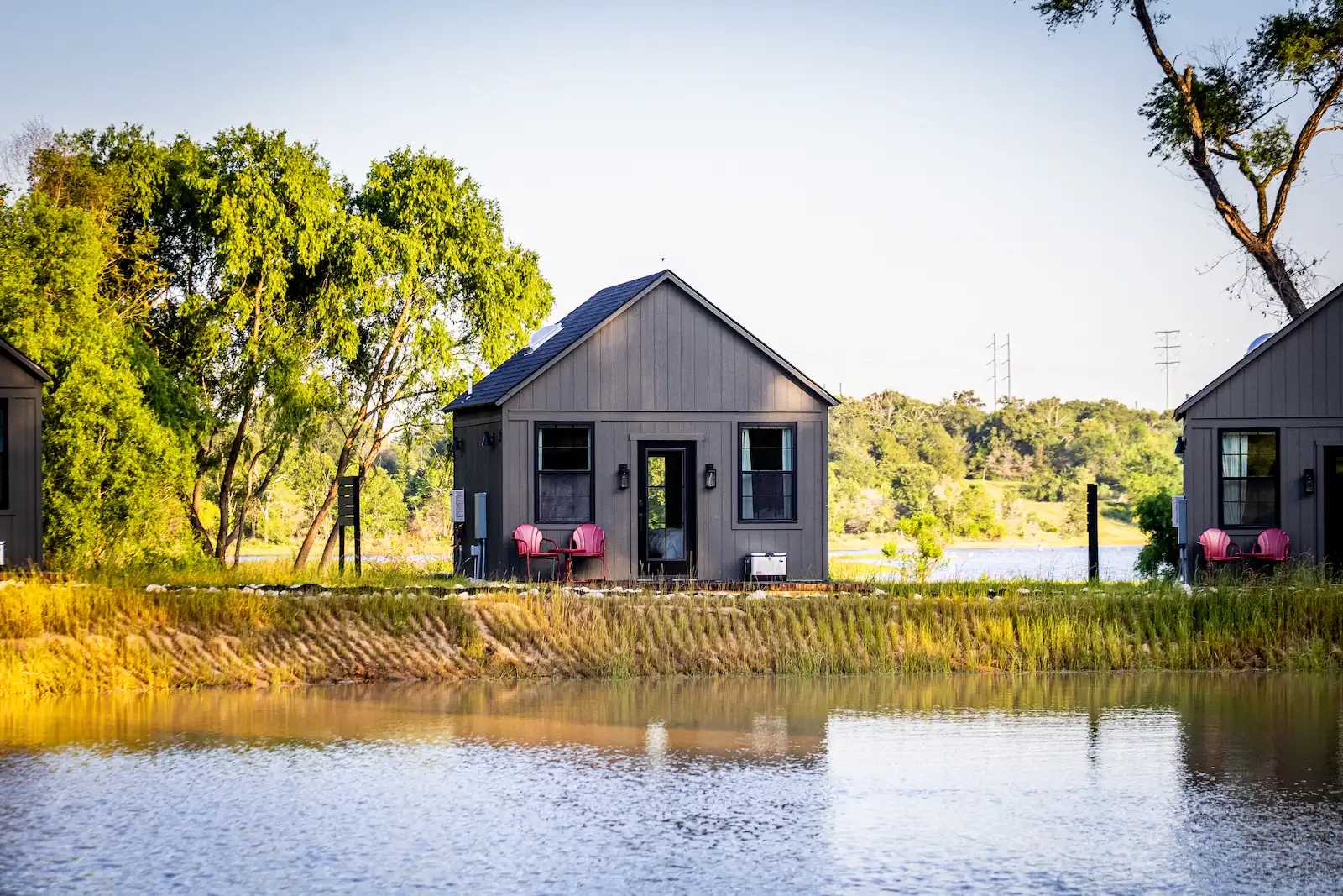 Richard Casteel Exterior of Premier Tall Ranch converted into a cabin by a lake