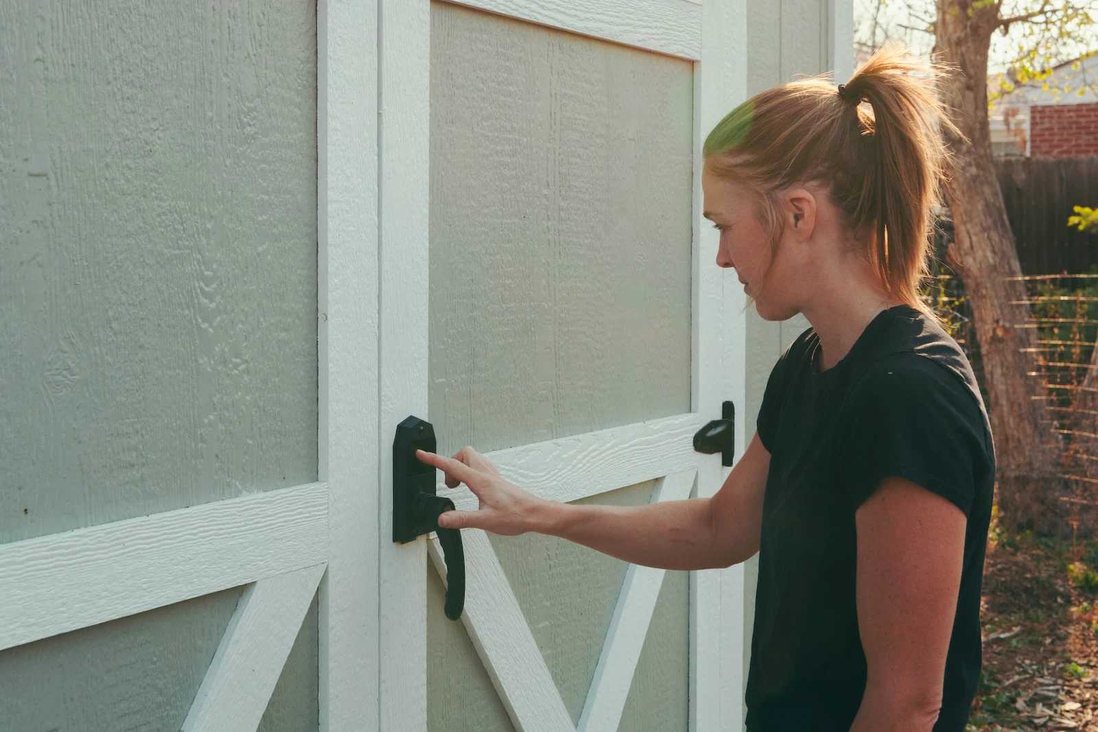 Karen using the keyless door handle on premier tall barn