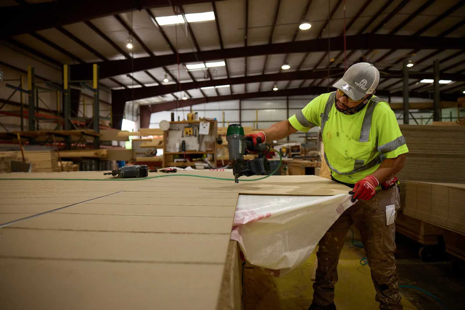 Tuff Shed employee working on a Premier PRO Tall Ranch at the Austin factory