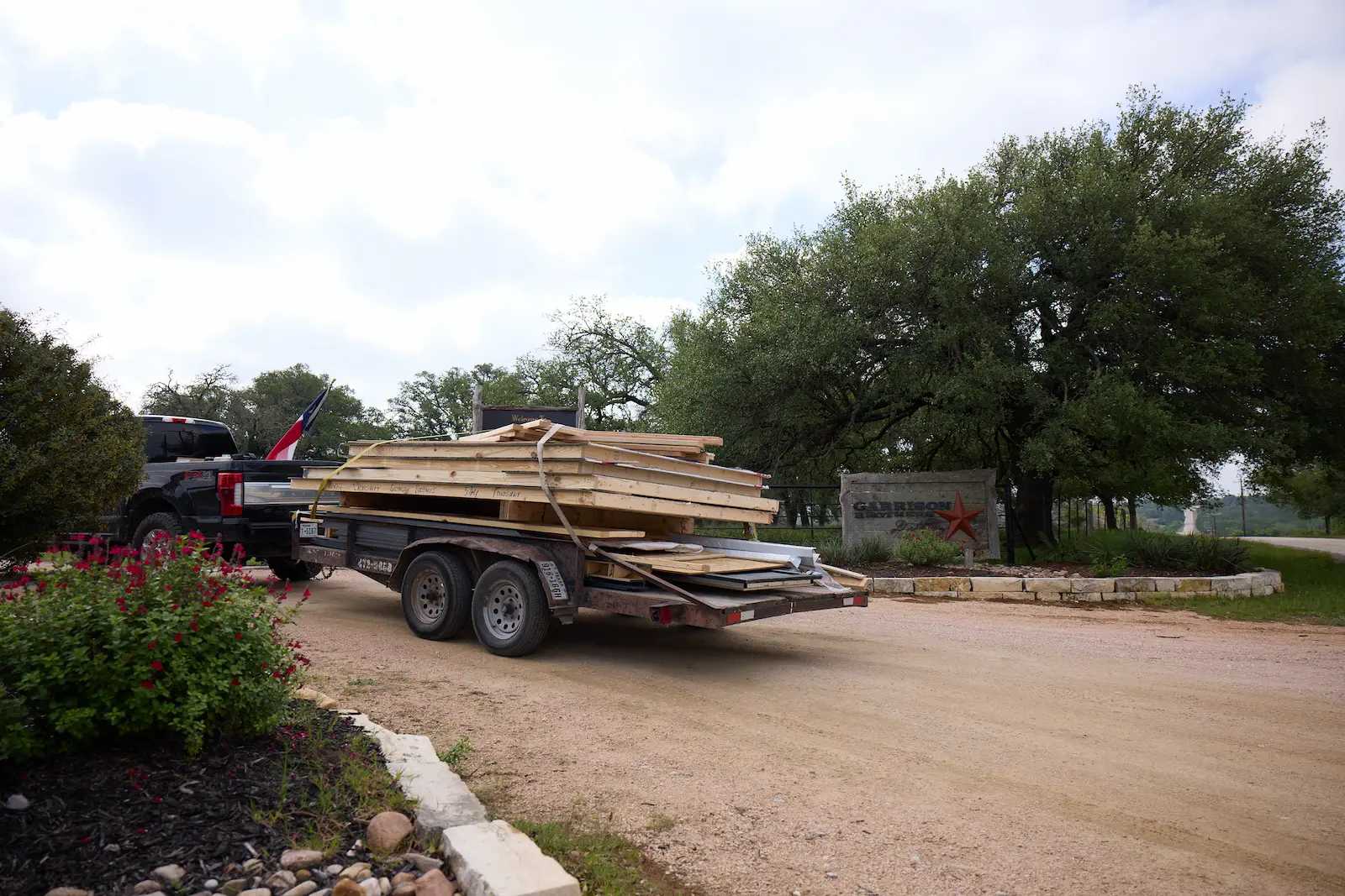 Truck with Tuff Shed kit of Premier PRO Tall Ranch pulling in to Garrison Brothers Distillery
