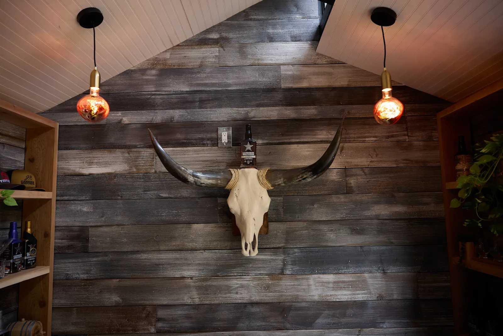 Interior of Premier PRO Tall Ranch fully finished with long horn on wall at Garrison Brothers Distillery