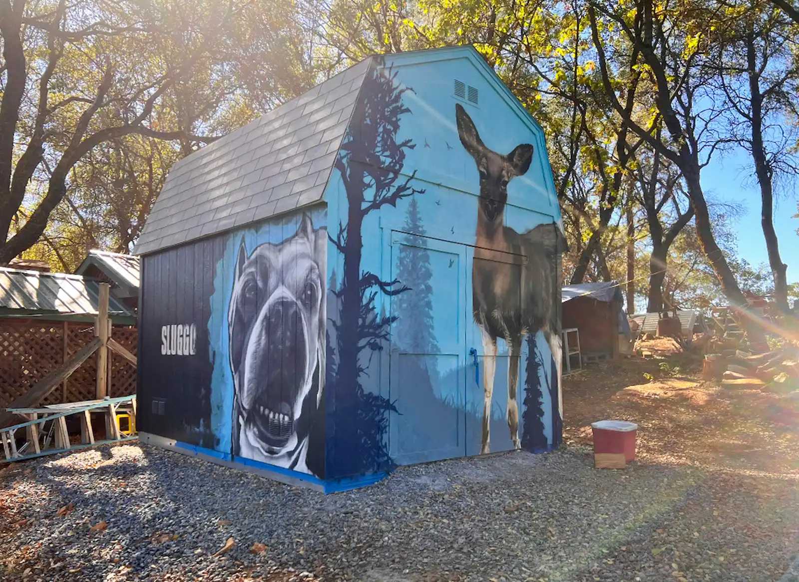 Premier Tall Barn painted with deer and dog murals