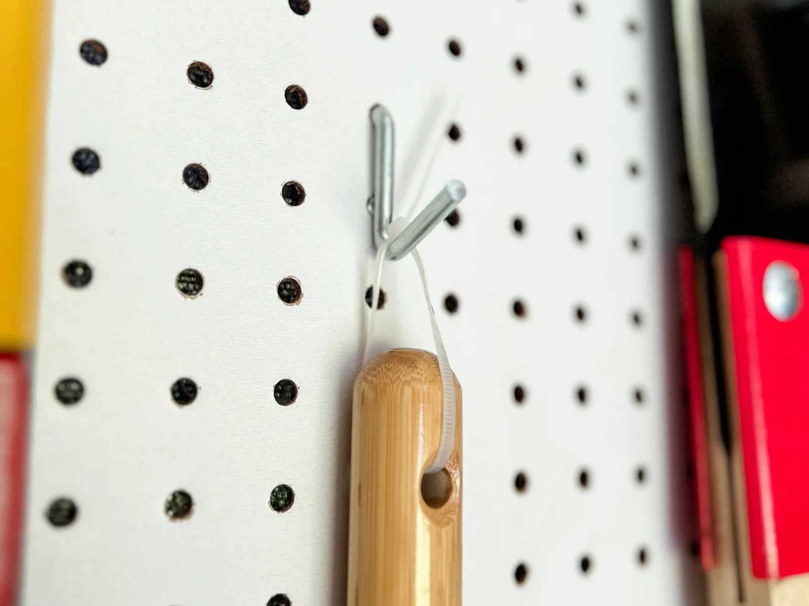 Interior of Premier PRO Tall Ranch building with organized pegboard wall with tool and zip tie