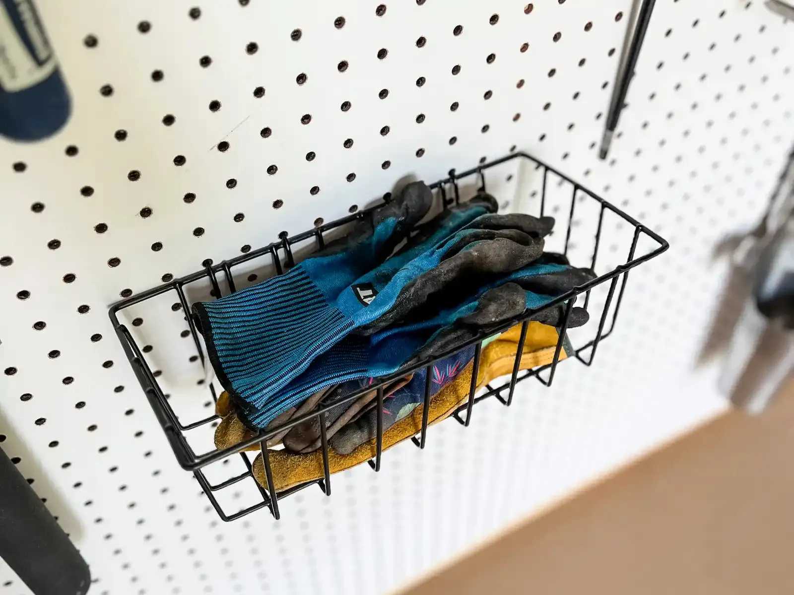Interior of Premier PRO Tall Ranch building with basket on pegboard wall