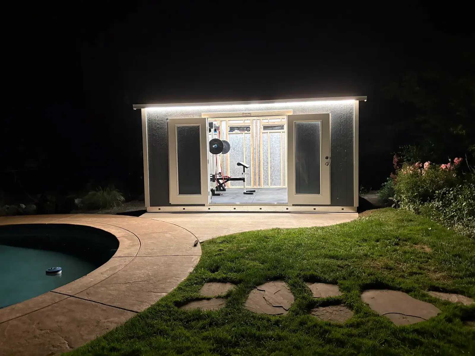 Exterior of Premier PRO Tall Ranch transformed into a home gym at night