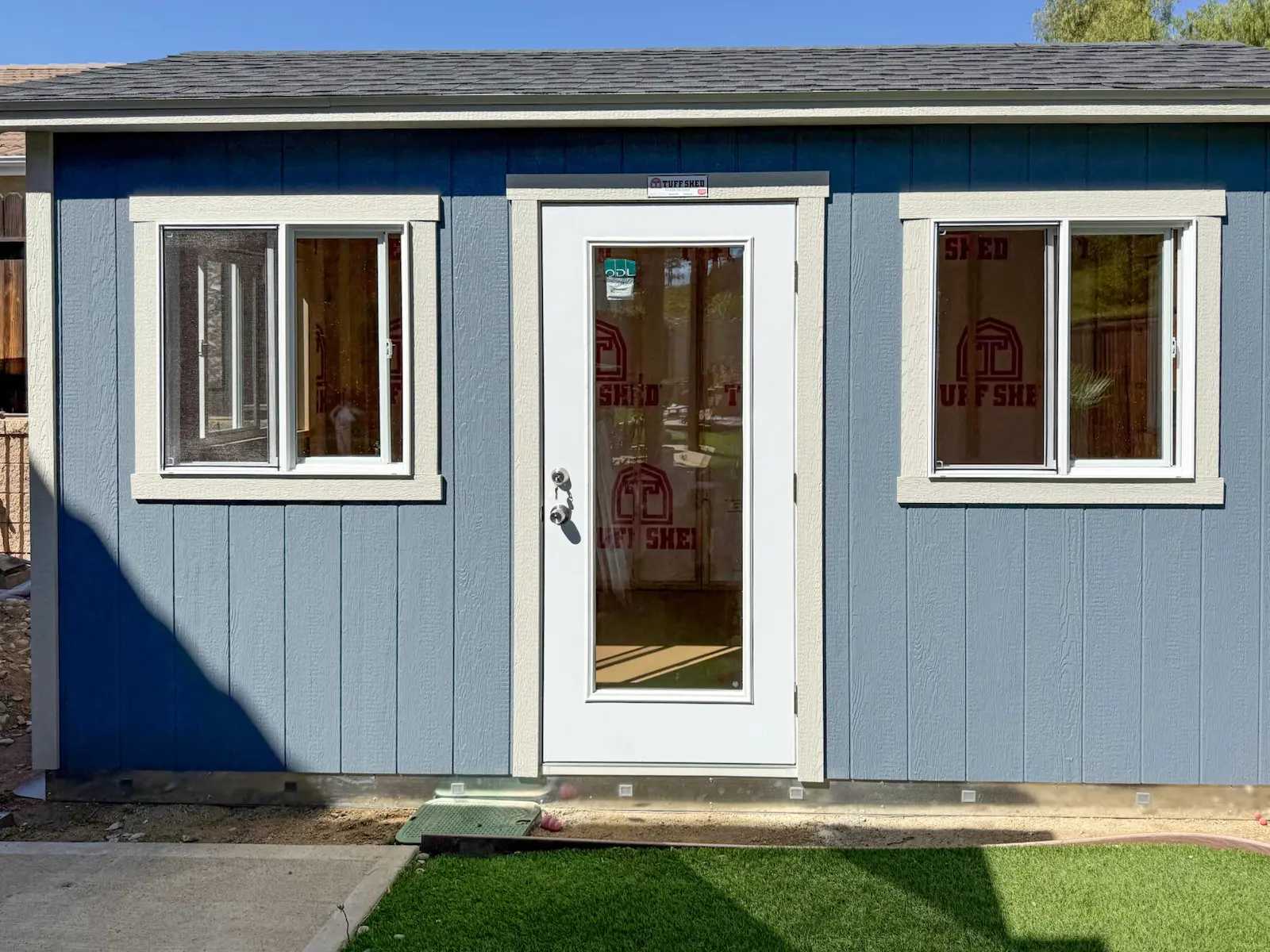 Premier Tall Ranch blue building in yard