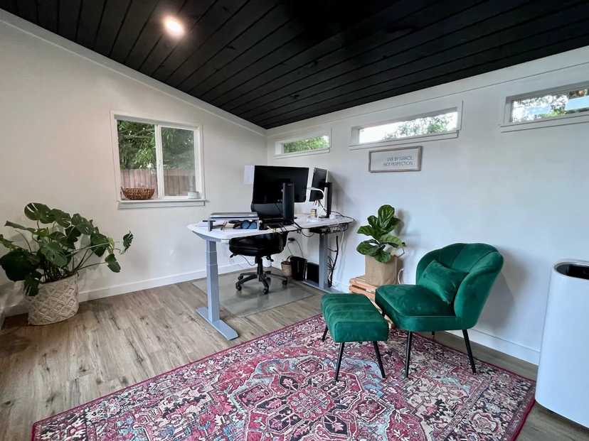 Interior of Premier Pro Studio with desk and green chair