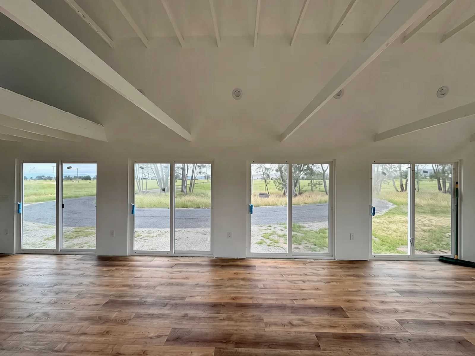 Interior of Premier PRO Tall Barn with finished floor and sliding glass doors