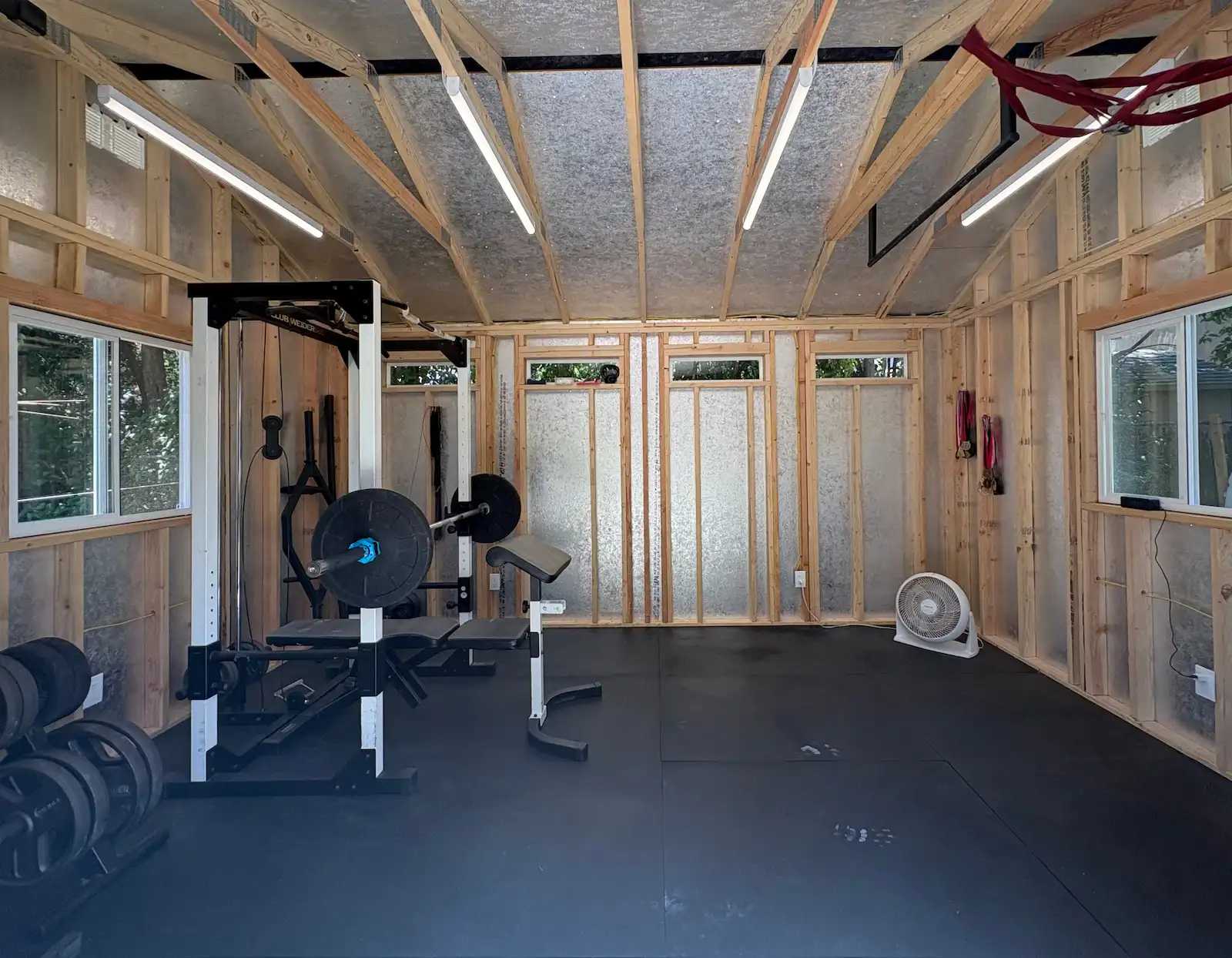 Interior of Premier PRO Tall Ranch home gym with equipment