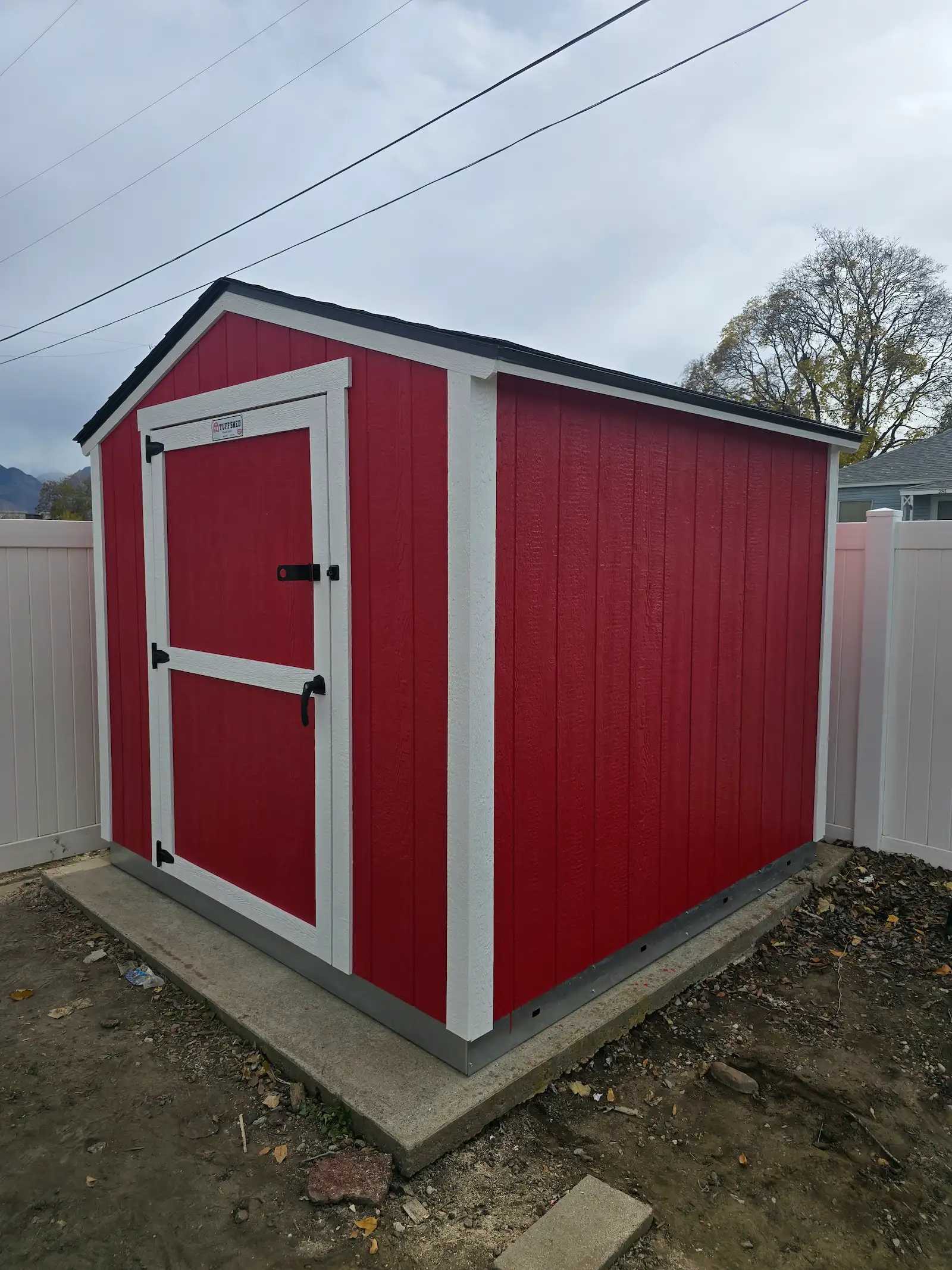 Premier Standard Ranch building in the corner of a backyard