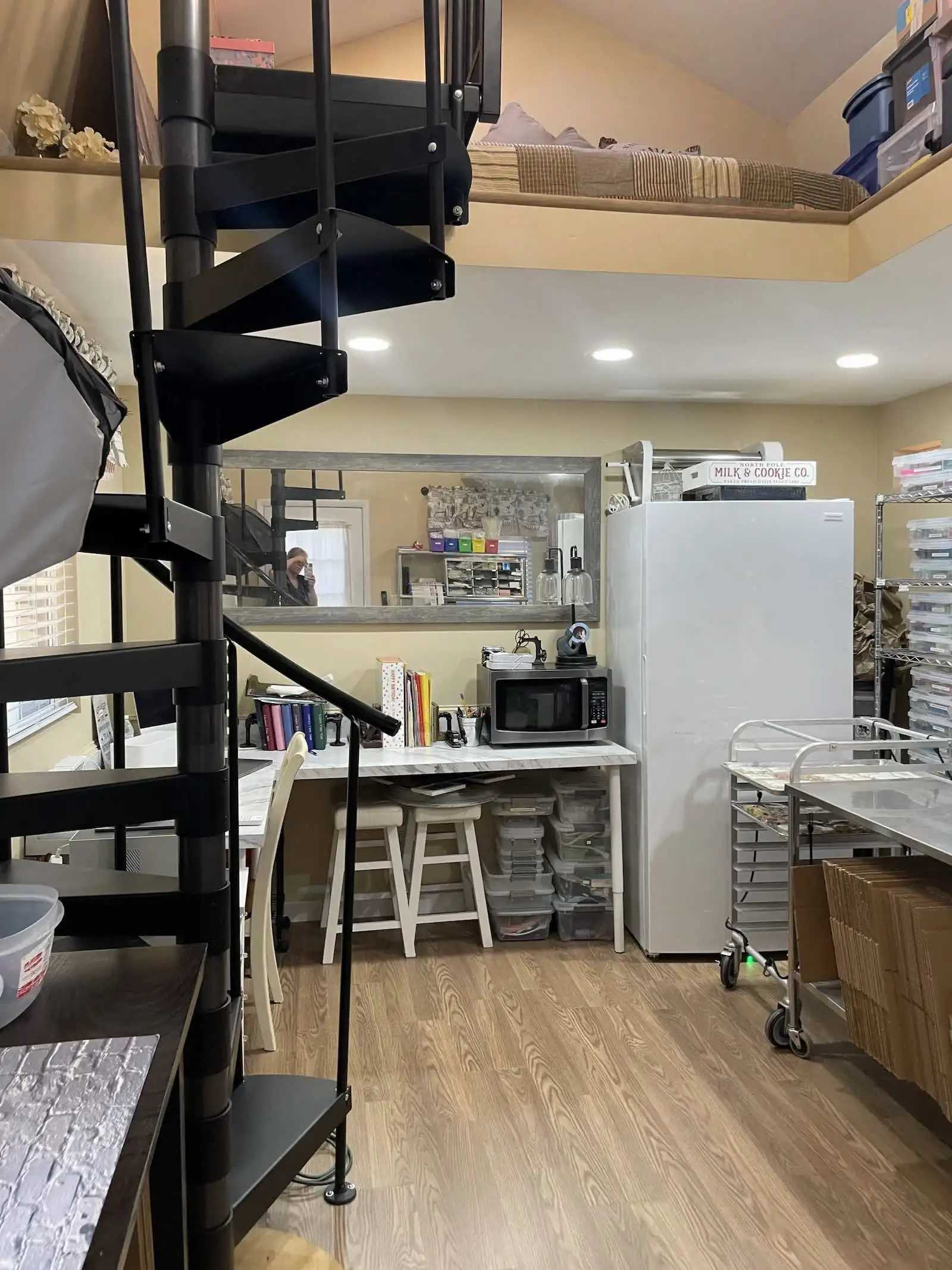 Interior of Premier Tall Barn with spiral staircase and fridge