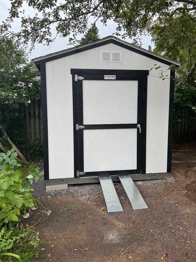 White Premier Ranch with regular duty ramps in a backyard