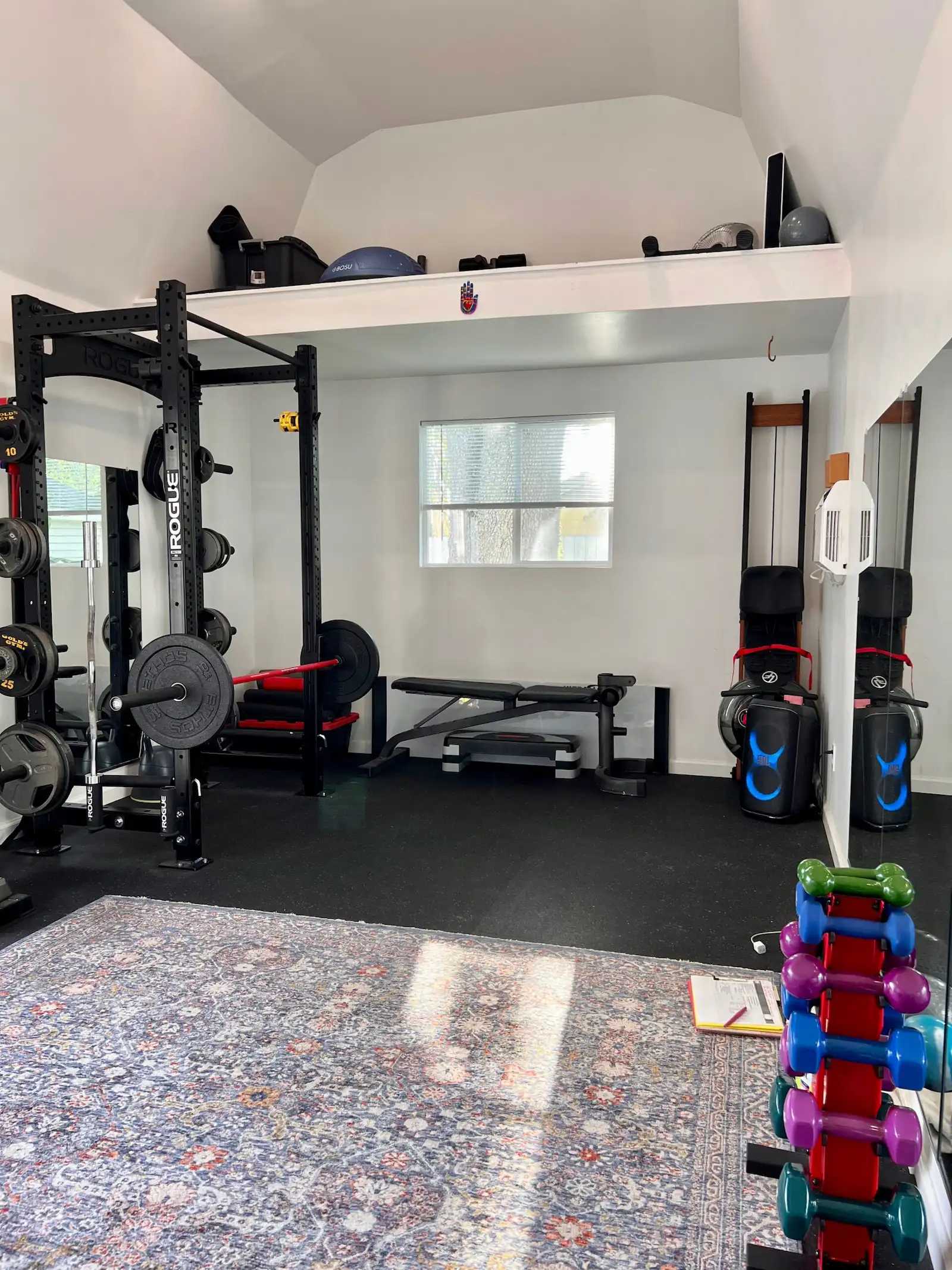 Premier Pro Tall Barn home gym interior with weights and loft