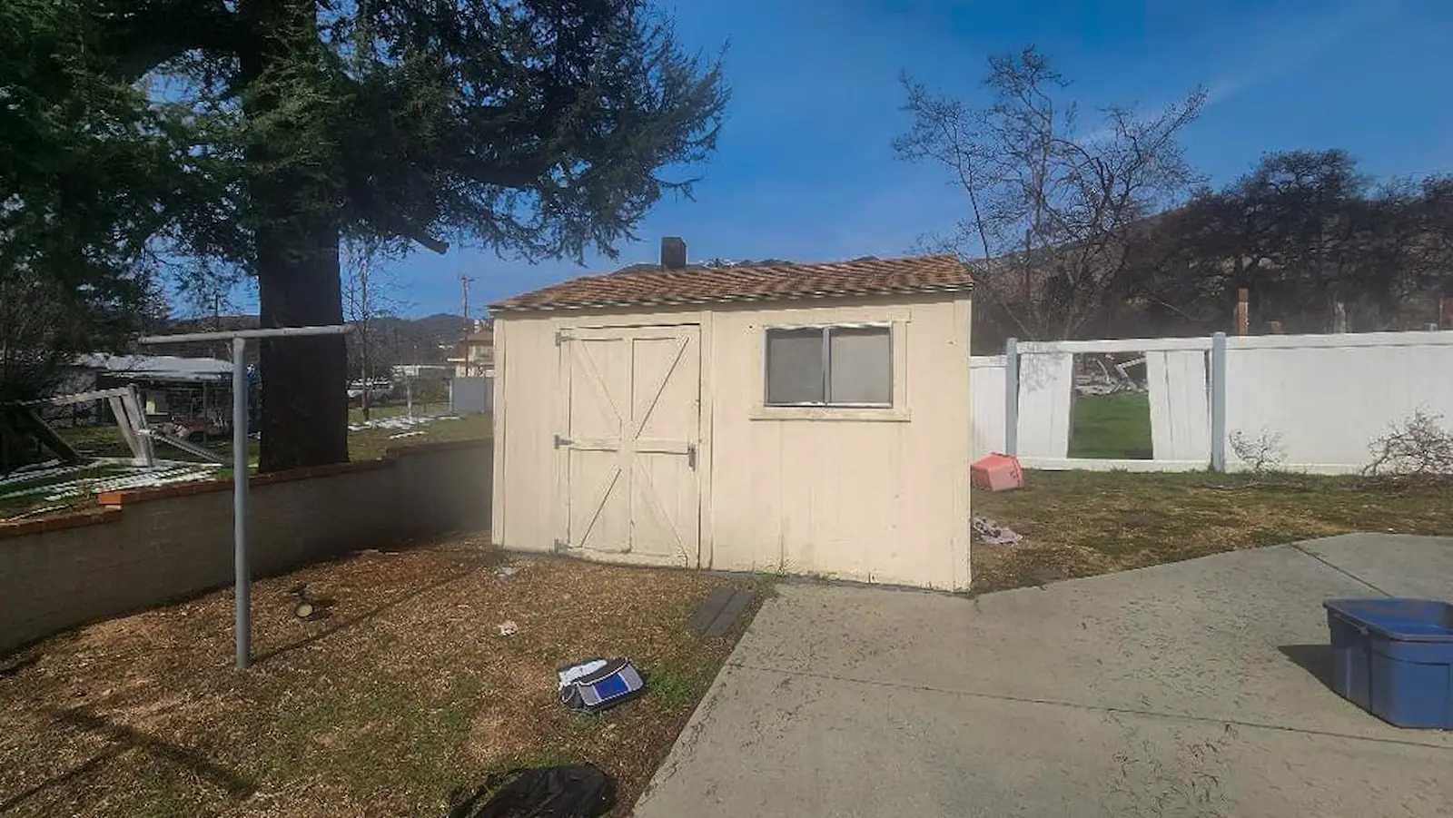Tan Premier Ranch shed on an open lot