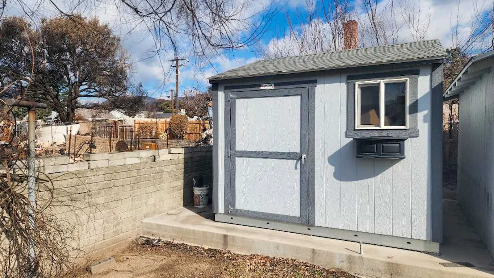 Grey Premier Ranch Shed on top of cement block