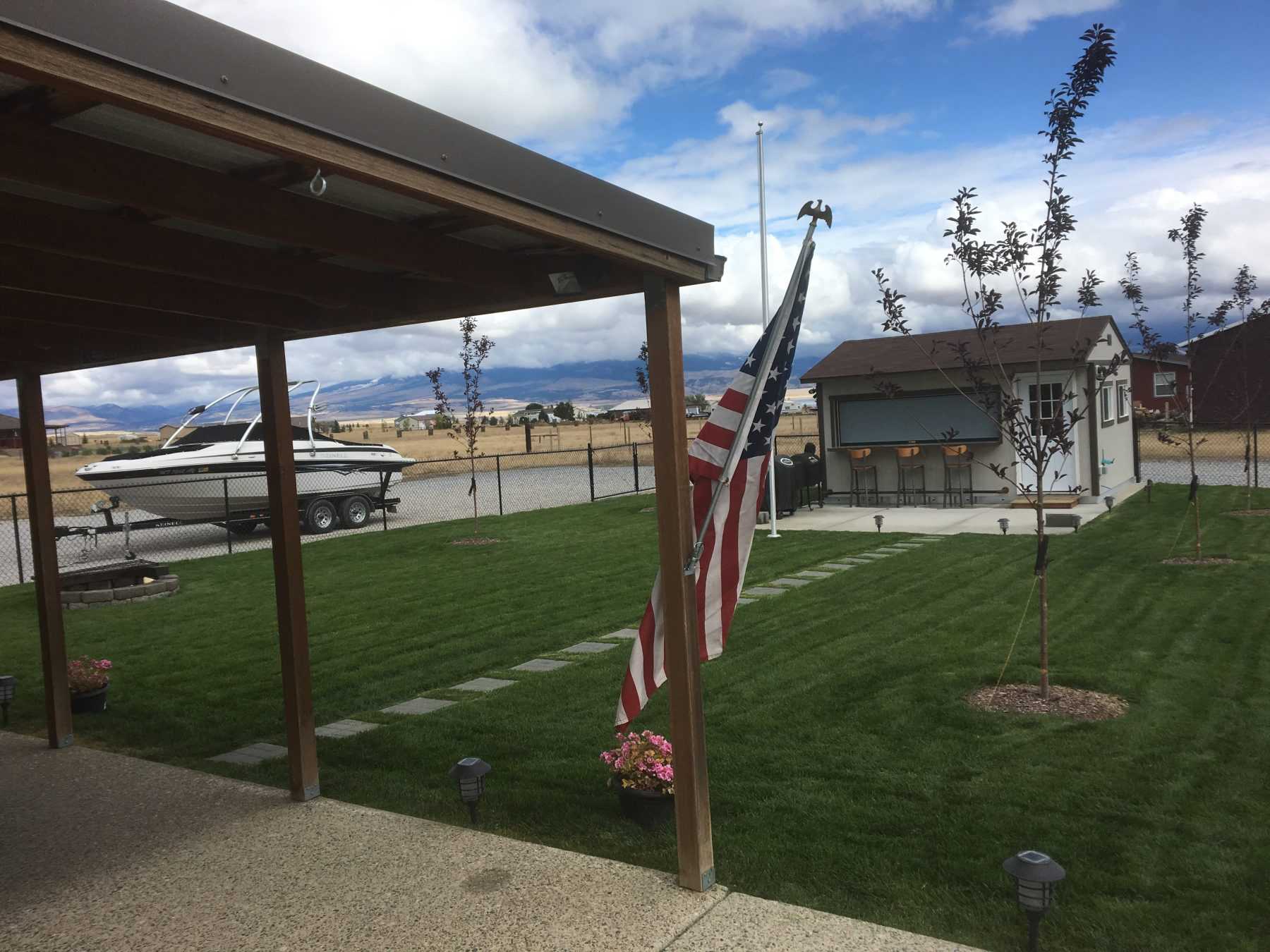 Exterior of the Premier Tall Ranch Bar Shed landscape