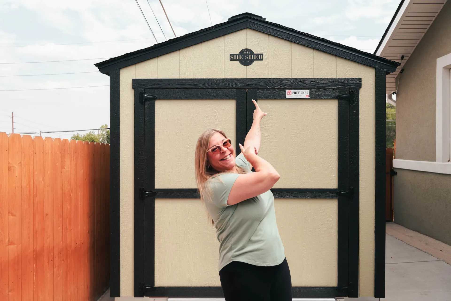 Charmaine standing in front of her green Premier Classic Ranch
