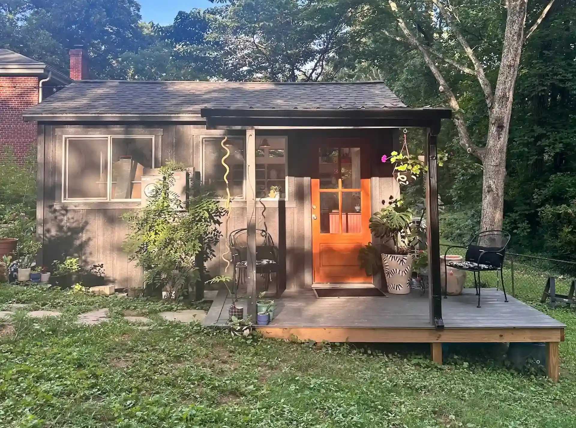 Exterior of Premier PRO Tall Ranch building in a slanted backyard