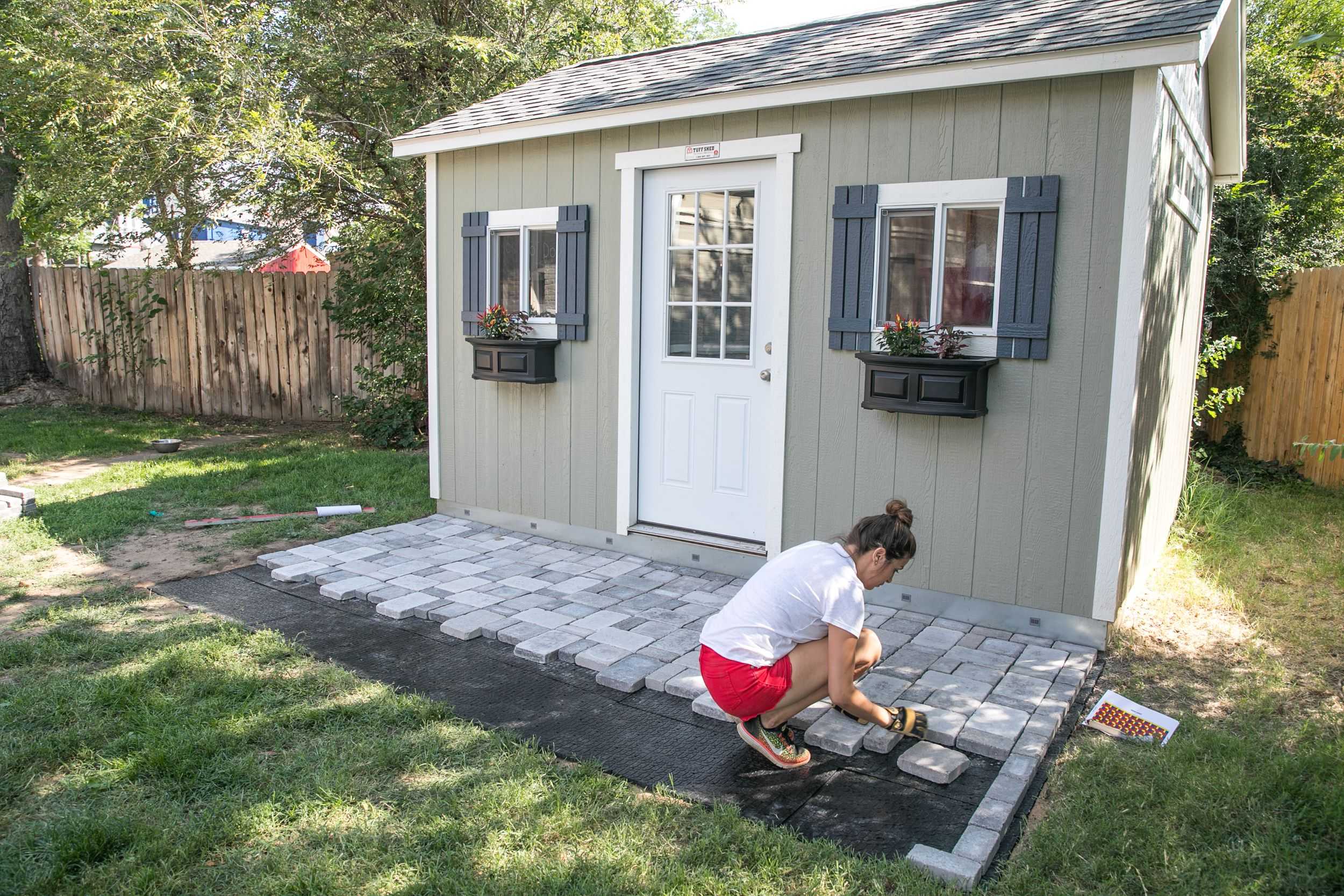 A premier pro tall ranch with someone making their own patio.