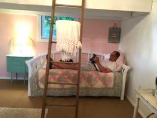 Steve relaxing on the Day Bed in the Premier Pro Tall Ranch She Shed