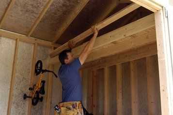 Putting up shelving inside a Tuff Shed