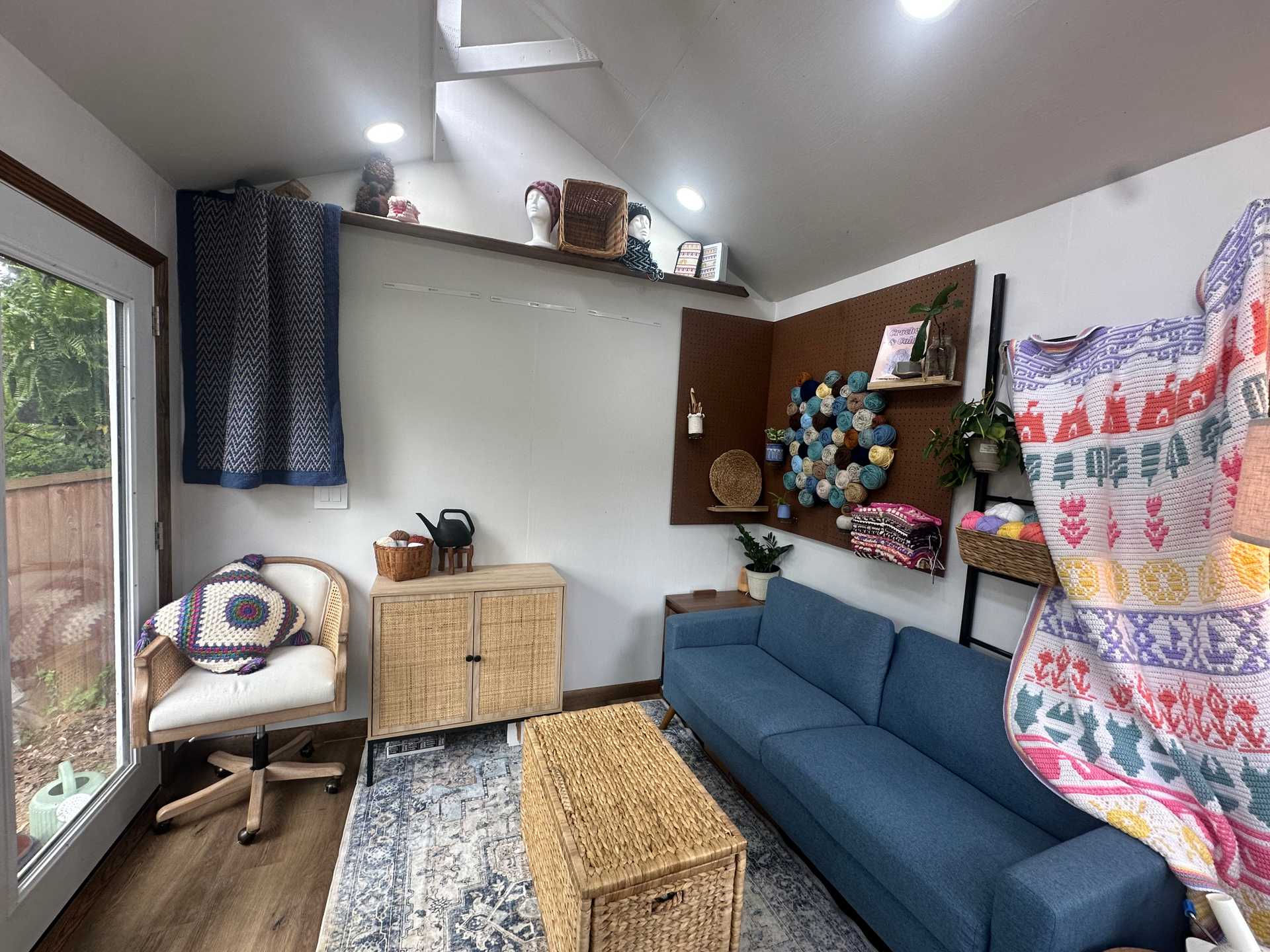 Interior of Premier PRO Tall Ranch crochet studio with couch and storage