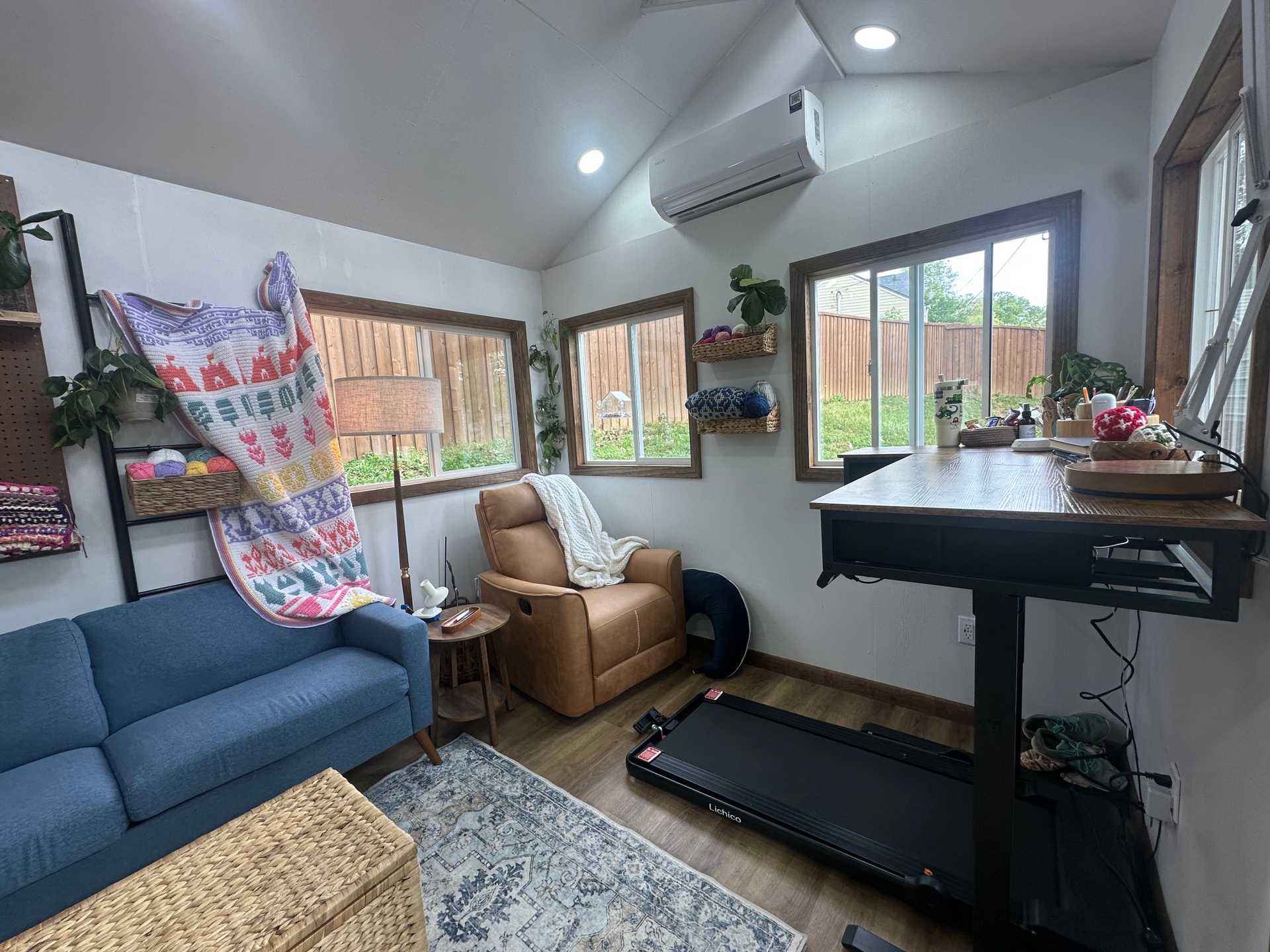 Interior of Premier PRO Tall Ranch crochet studio with desk, couch, and chair
