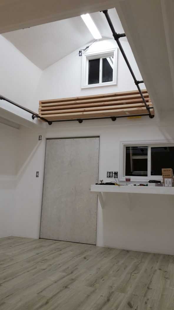 Another angle of the shed this time facing the door showing the shelf