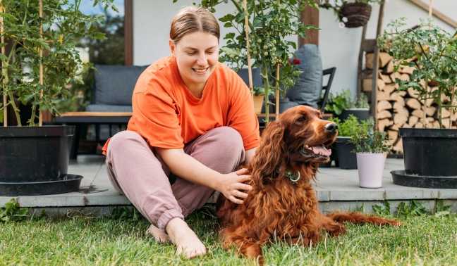 Customer in back yard with dog