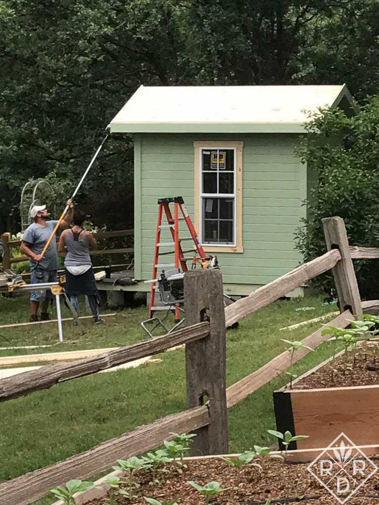 Exterior of the Premier Pro Tall Ranch Gardening Shed Being Painted