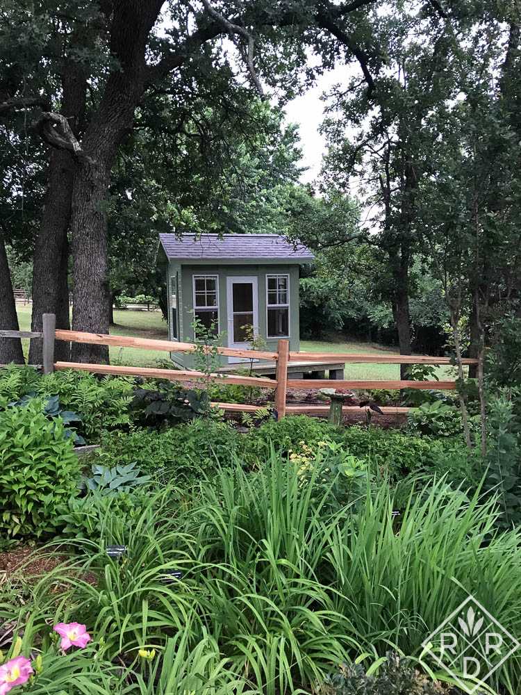Exterior of the Premier Pro Tall Ranch Gardening Shed Surrounded by Gardens