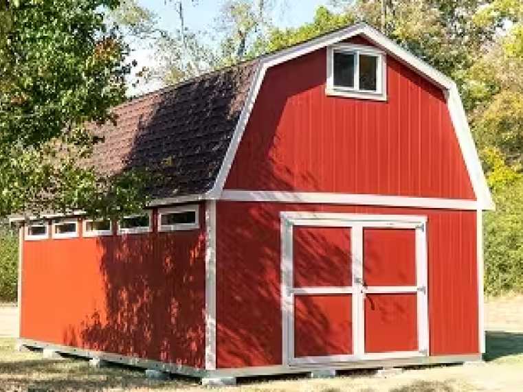 a red barn with side transom windows and a double door