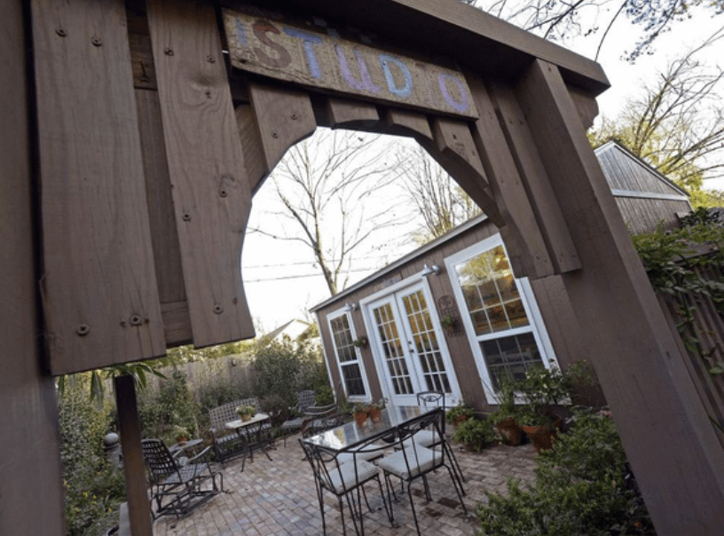 Tuff Shed Art Studio in backyard on brick patio
