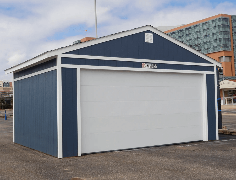 Exterior shot of blue premier ranch garage with a white door